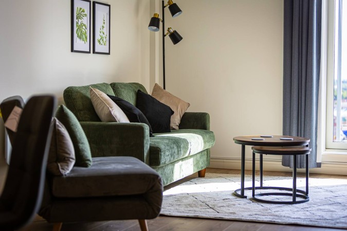 Spacious Airbnb living room with comfortable sofa seating area.