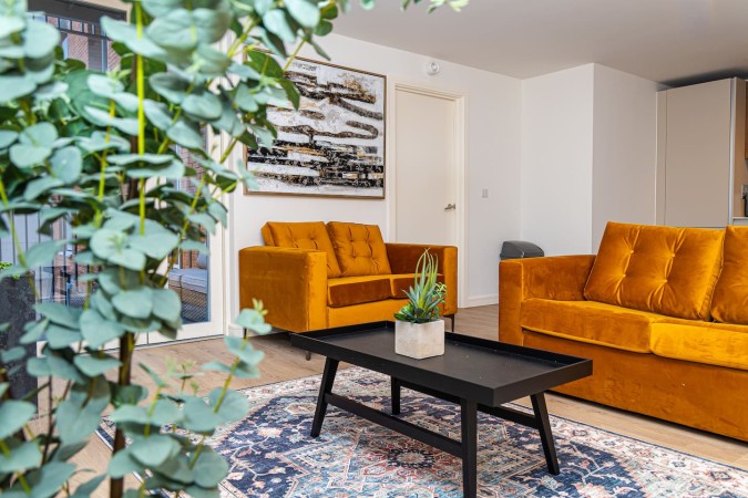 Comfortable Airbnb living room with spacious sofa seating.