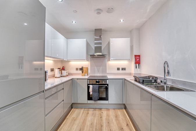 Modern Airbnb kitchen with sleek contemporary design.
